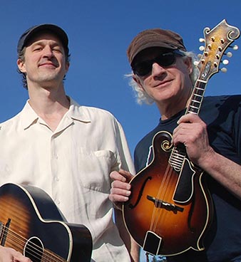 Image of Spud and Michael Shay with blue sky backdrop